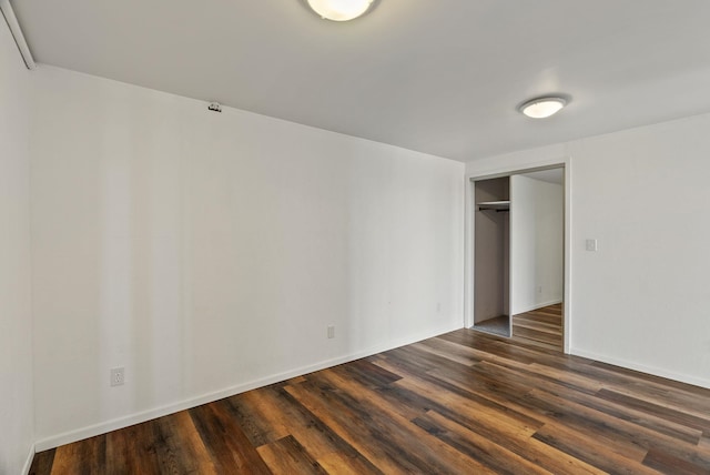 4626 E Orchard Rd, Spokane, WA 99217 - unfurnished bedroom with dark wood-type flooring, a closet, and baseboards