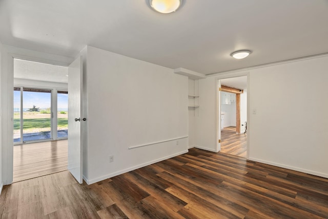 4626 E Orchard Rd, Spokane, WA 99217 - unfurnished room featuring dark wood-style floors and baseboards