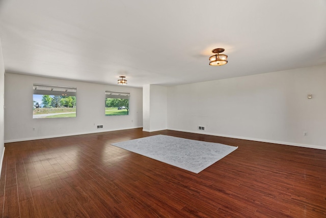 4626 E Orchard Rd, Spokane, WA 99217 - empty room featuring dark wood-style flooring and baseboards