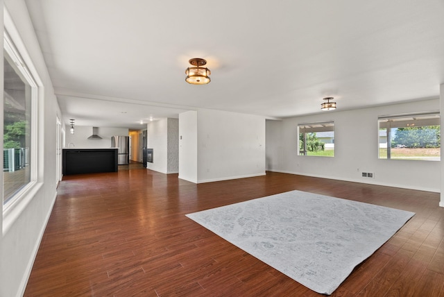 4626 E Orchard Rd, Spokane, WA 99217 - unfurnished living room featuring dark wood finished floors and baseboards