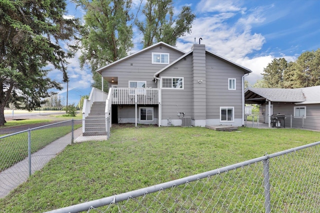4606 S Grove Rd, Spokane, WA 99224 - rear view of property with central AC unit, stairway, a wooden deck, and a chimney