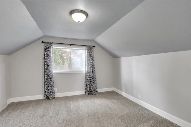 4606 S Grove Rd, Spokane, WA 99224 - additional living space featuring vaulted ceiling, carpet flooring, and baseboards