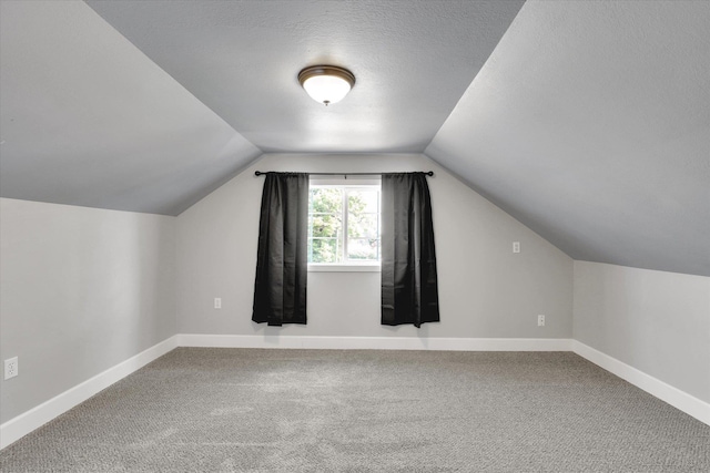 4606 S Grove Rd, Spokane, WA 99224 - additional living space featuring carpet flooring, vaulted ceiling, and baseboards
