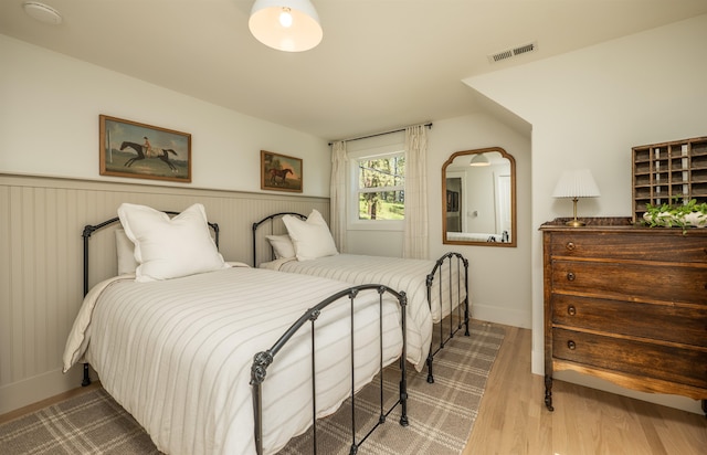 19009 N Little Spokane Dr, Colbert, WA 99005 - bedroom featuring wood finished floors and wainscoting