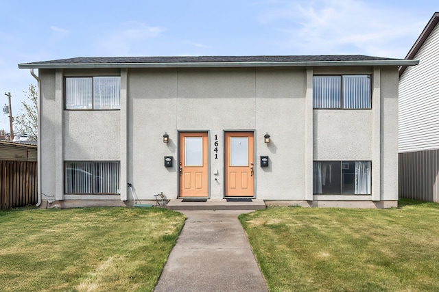 1641 E Crown Ave, Spokane, WA 99207 - entrance to property featuring a lawn, stucco siding, and roof with shingles