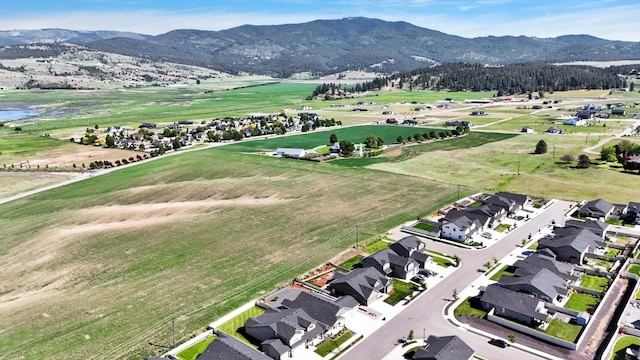 1725 S Donwood St, Spokane Valley, WA 99037 - aerial overview of property's location with a mountain backdrop and nearby suburban area