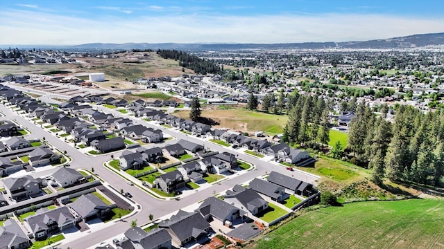 1725 S Donwood St, Spokane Valley, WA 99037 - aerial view of property and surrounding area featuring nearby suburban area and a mountainous background