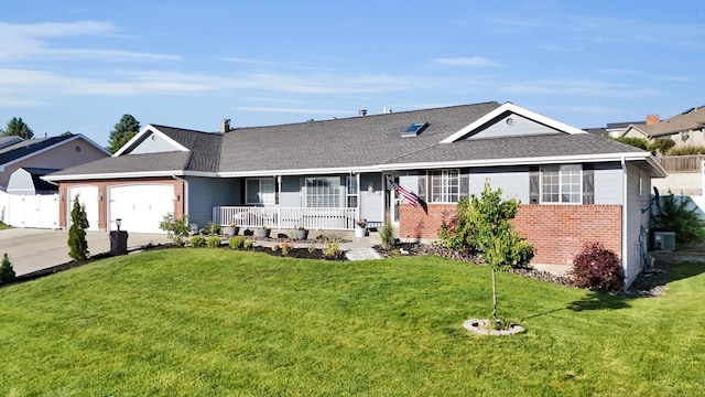 10102 N Comanche Dr, Spokane, WA 99208 - single story home with covered porch, brick siding, concrete driveway, an attached garage, and roof with shingles