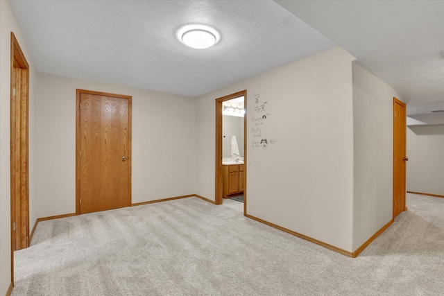 10102 N Comanche Dr, Spokane, WA 99208 - spare room featuring light carpet and baseboards