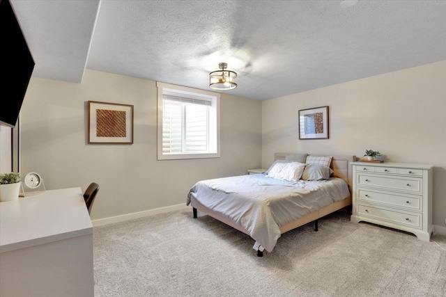 10102 N Comanche Dr, Spokane, WA 99208 - bedroom with light carpet, baseboards, and a textured ceiling