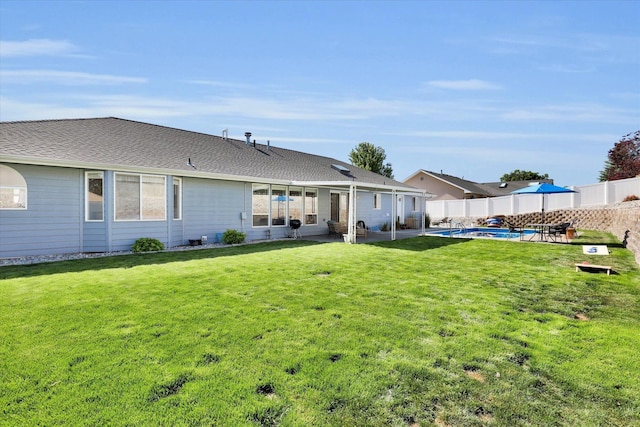10102 N Comanche Dr, Spokane, WA 99208 - back of property with a patio area and roof with shingles