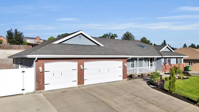 10102 N Comanche Dr, Spokane, WA 99208 - single story home featuring driveway, an attached garage, roof with shingles, and brick siding