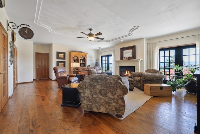 5711 E Nancy Ln, Mead, WA 99021 - living room with dark wood finished floors, a glass covered fireplace, plenty of natural light, recessed lighting, and a ceiling fan