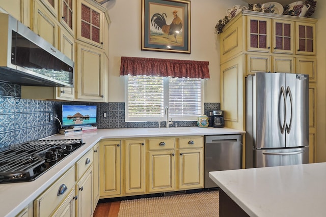 5711 E Nancy Ln, Mead, WA 99021 - kitchen with appliances with stainless steel finishes, cream cabinetry, light countertops, and a sink