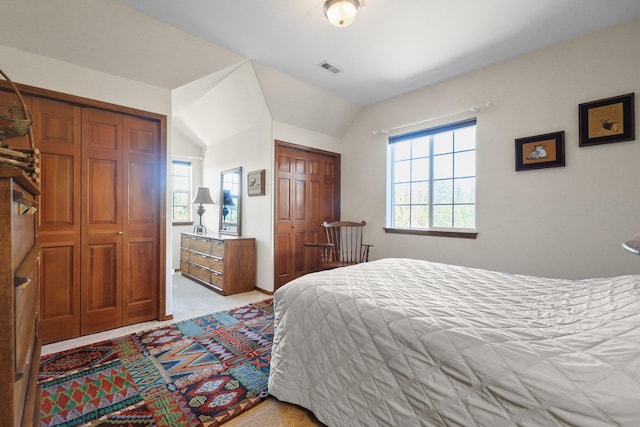5711 E Nancy Ln, Mead, WA 99021 - bedroom with two closets, light colored carpet, and vaulted ceiling