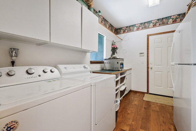 5711 E Nancy Ln, Mead, WA 99021 - washroom featuring washer and dryer, cabinet space, and wood finished floors