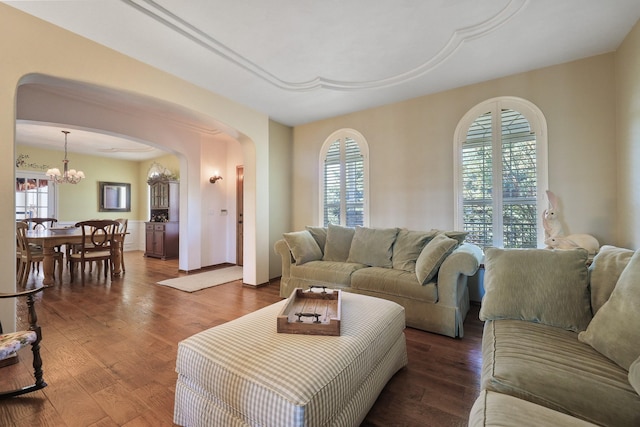 5711 E Nancy Ln, Mead, WA 99021 - living room featuring arched walkways, a chandelier, and wood finished floors