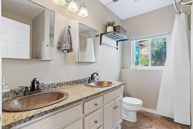 1725 N Mcmillan Ln, Spokane Valley, WA 99016 - bathroom featuring toilet, double vanity, a shower with curtain, and tile patterned floors