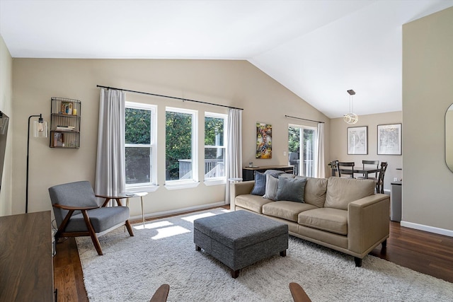 1725 N Mcmillan Ln, Spokane Valley, WA 99016 - living area featuring wood finished floors, vaulted ceiling, and baseboards
