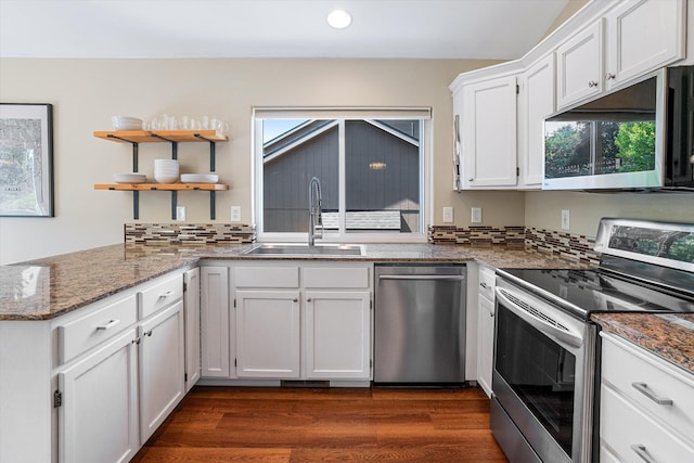 1725 N Mcmillan Ln, Spokane Valley, WA 99016 - kitchen with stainless steel appliances, a sink, white cabinetry, recessed lighting, and dark wood finished floors