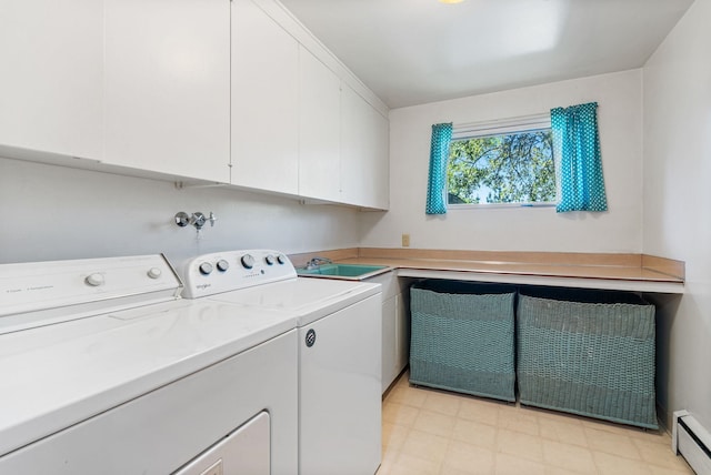 2616 S SE Blvd Unit 2606, Spokane, WA 99223 - laundry room featuring a baseboard radiator, cabinet space, and washing machine and clothes dryer