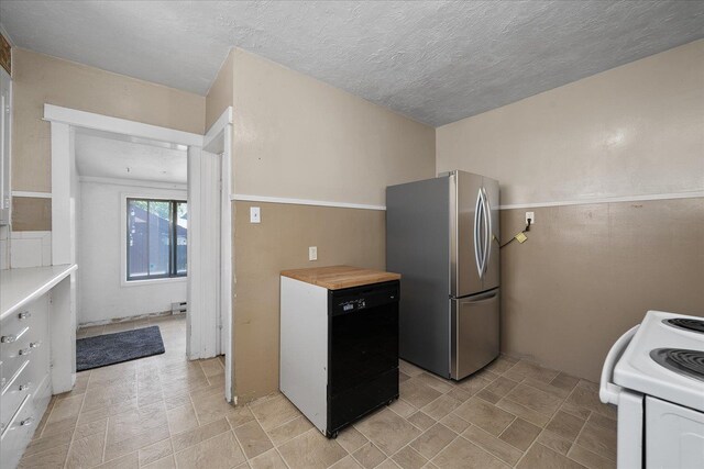 617 W Carlisle Ave, Spokane, WA 99205 - kitchen featuring freestanding refrigerator, dishwasher, white electric range oven, a textured ceiling, and a baseboard radiator