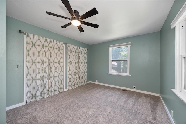 617 W Carlisle Ave, Spokane, WA 99205 - empty room featuring carpet, ceiling fan, and baseboards