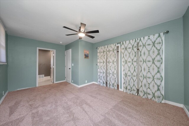 617 W Carlisle Ave, Spokane, WA 99205 - unfurnished bedroom featuring carpet, baseboards, and a ceiling fan