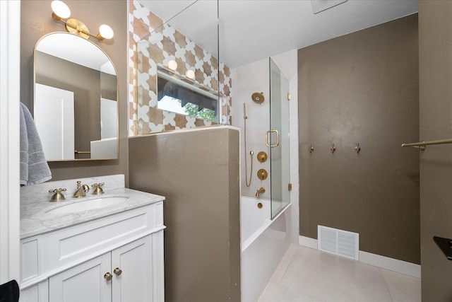 617 W Carlisle Ave, Spokane, WA 99205 - bathroom with vanity, tile patterned floors, combined bath / shower with glass door, and baseboards