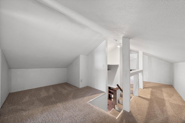 617 W Carlisle Ave, Spokane, WA 99205 - additional living space featuring carpet floors, lofted ceiling, and a textured ceiling