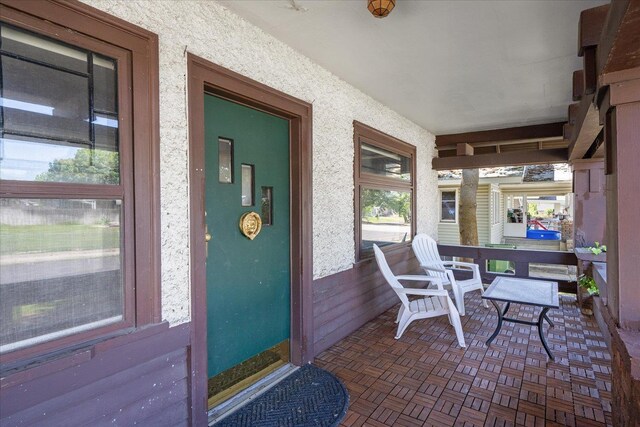 617 W Carlisle Ave, Spokane, WA 99205 - view of exterior entry with a porch and stucco siding