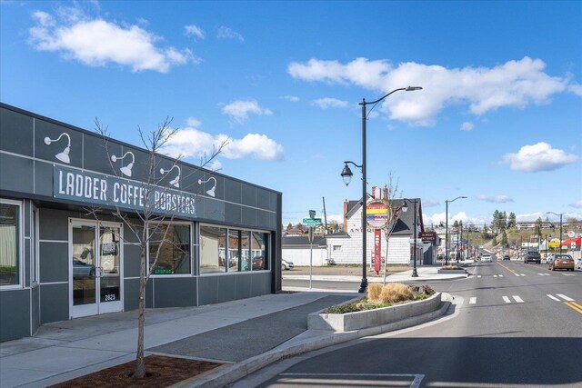 617 W Carlisle Ave, Spokane, WA 99205 - view of asphalt road featuring street lighting, sidewalks, and curbs