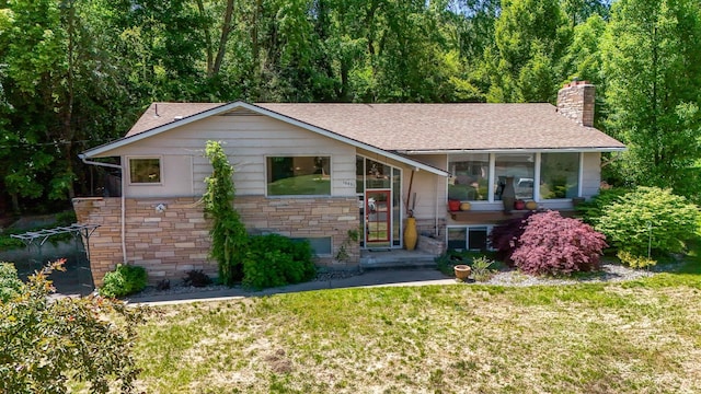 10401 N College Cir, Spokane, WA 99218 - view of front facade featuring a shingled roof, a chimney, a front lawn, and stone siding