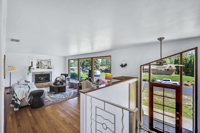 10401 N College Cir, Spokane, WA 99218 - living room featuring wood finished floors and a glass covered fireplace
