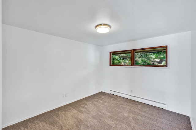 10401 N College Cir, Spokane, WA 99218 - carpeted empty room with a baseboard heating unit and baseboards