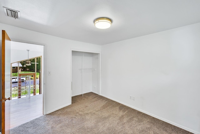10401 N College Cir, Spokane, WA 99218 - unfurnished bedroom featuring carpet flooring, baseboards, and a closet