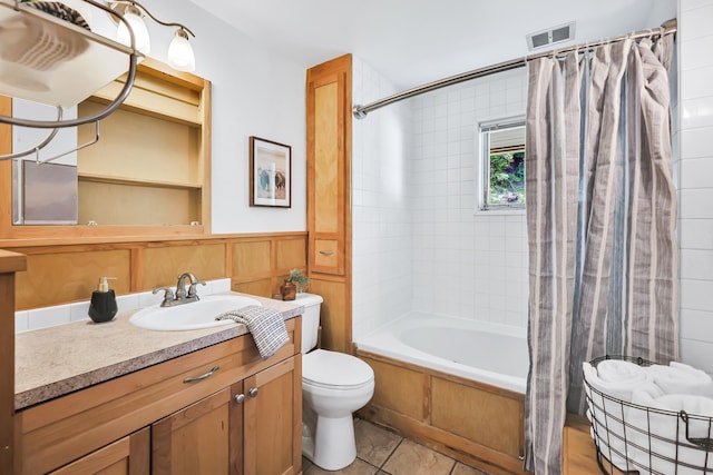 10401 N College Cir, Spokane, WA 99218 - full bathroom with toilet, shower / bath combination with curtain, vanity, tile patterned flooring, and wainscoting