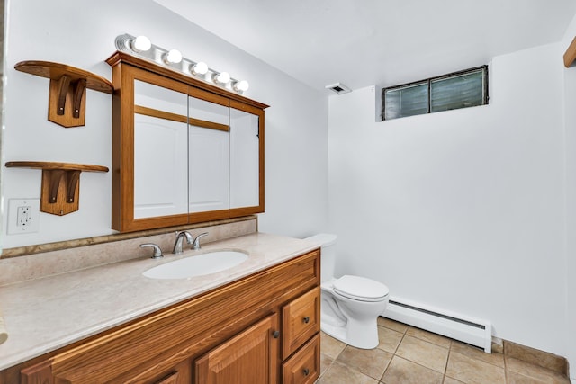 10401 N College Cir, Spokane, WA 99218 - bathroom with baseboard heating, vanity, toilet, and tile patterned flooring
