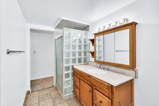 10401 N College Cir, Spokane, WA 99218 - bathroom featuring a stall shower, vanity, tile patterned floors, and baseboards