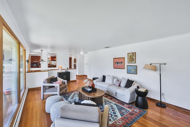 10401 N College Cir, Spokane, WA 99218 - living room with baseboard heating, wood finished floors, and baseboards