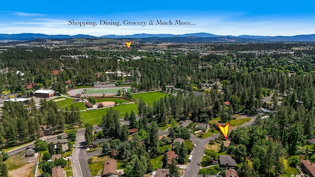 10401 N College Cir, Spokane, WA 99218 - aerial overview of property's location with mountains and a forest