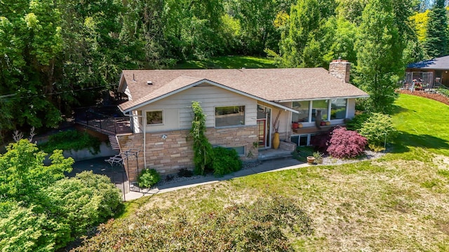 10401 N College Cir, Spokane, WA 99218 - view of front facade featuring a front lawn, stone siding, a chimney, stairway, and a shingled roof