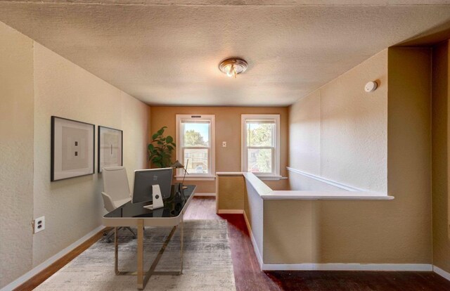 18 N 7th St, Cheney, WA 99004 - office with wood finished floors, baseboards, and a textured wall