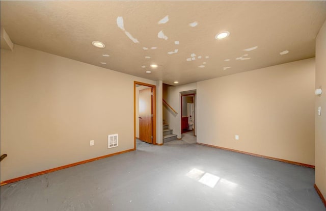 18 N 7th St, Cheney, WA 99004 - unfurnished room with recessed lighting, stairs, baseboards, and finished concrete floors