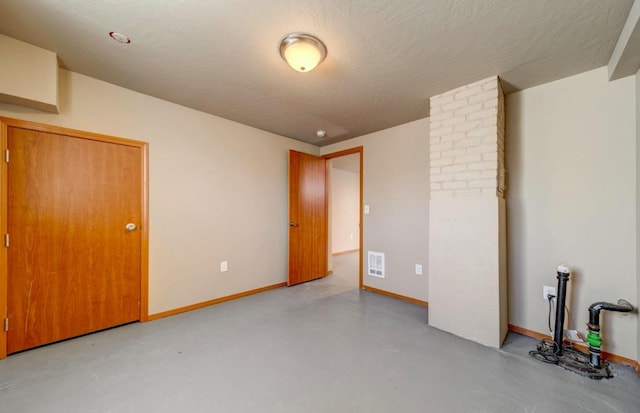 18 N 7th St, Cheney, WA 99004 - unfurnished bedroom with concrete flooring and baseboards