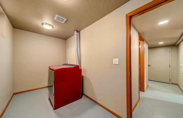 18 N 7th St, Cheney, WA 99004 - finished below grade area with baseboards, a textured ceiling, and fridge