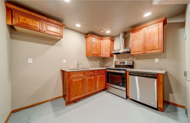 18 N 7th St, Cheney, WA 99004 - kitchen featuring stainless steel appliances, baseboards, wall chimney exhaust hood, finished concrete floors, and a sink
