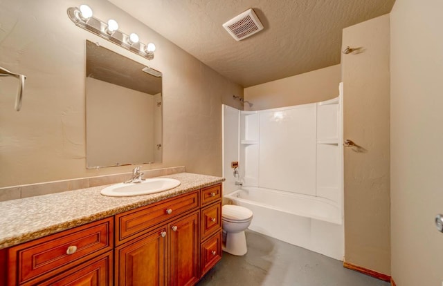 18 N 7th St, Cheney, WA 99004 - full bath with finished concrete flooring, vanity, toilet, shower / tub combination, and a textured ceiling