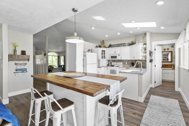 12621 N E Newman Lake Dr, Newman Lake, WA 99025 - kitchen featuring white appliances, butcher block counters, dark wood-style floors, white cabinets, and recessed lighting