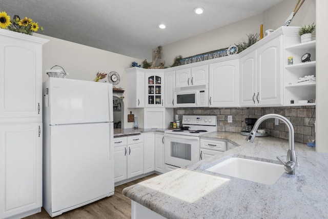 12621 N E Newman Lake Dr, Newman Lake, WA 99025 - kitchen featuring white appliances, a sink, white cabinets, and recessed lighting